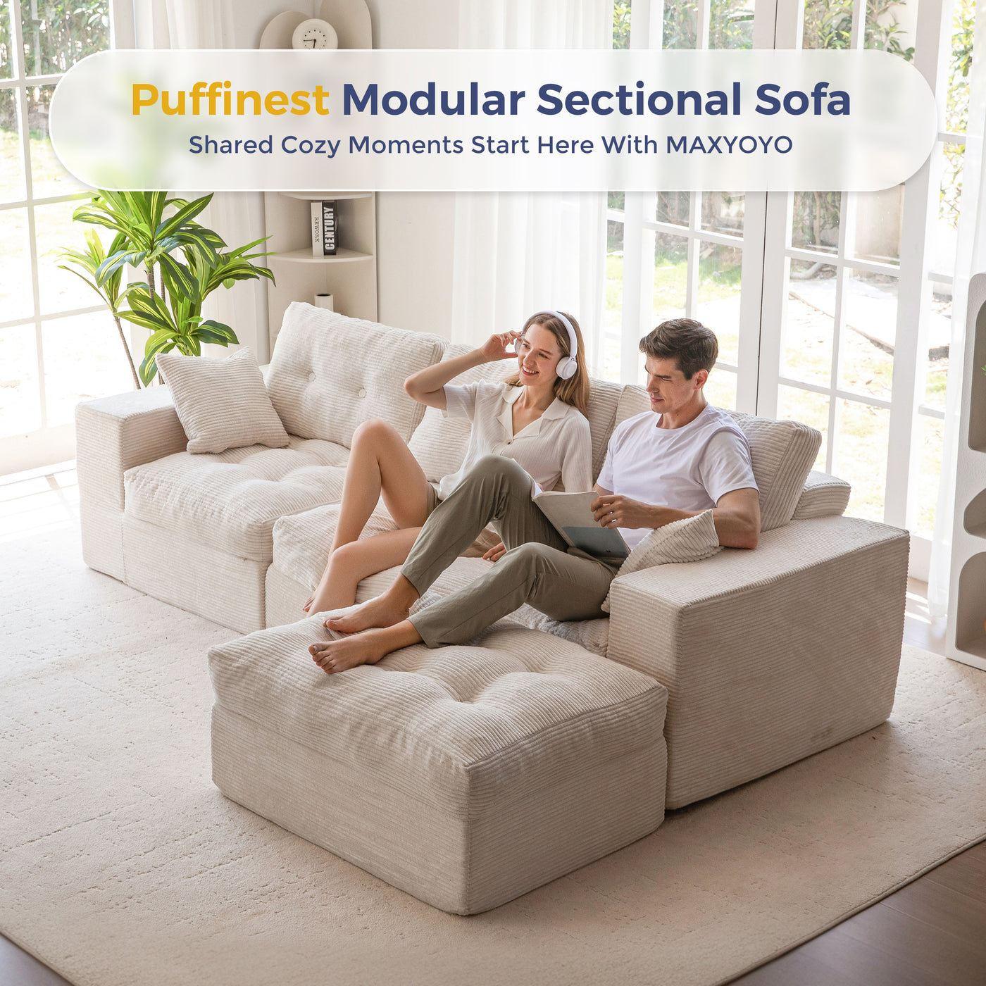 Two people sitting on a beige modular sectional sofa in a bright living room.