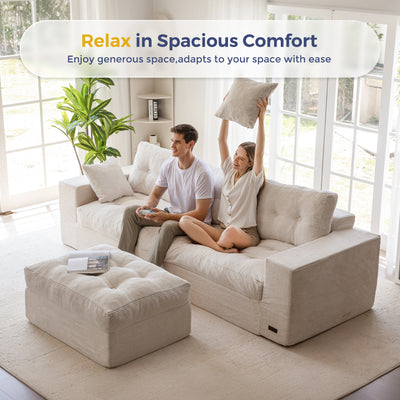 Couple relaxing on a large beige sectional sofa in a bright living room.